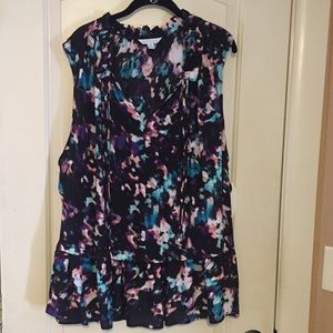 Boutique ruffled hem sheer sleeveless blouse